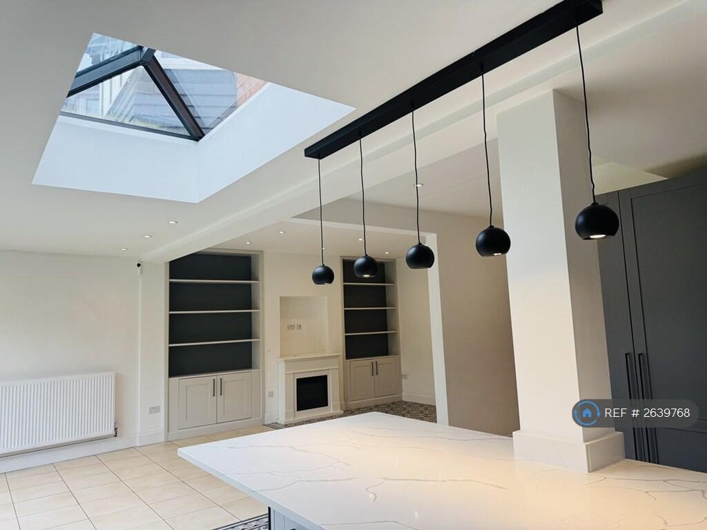 Light Streams Into The Kitchen From The Skylight.