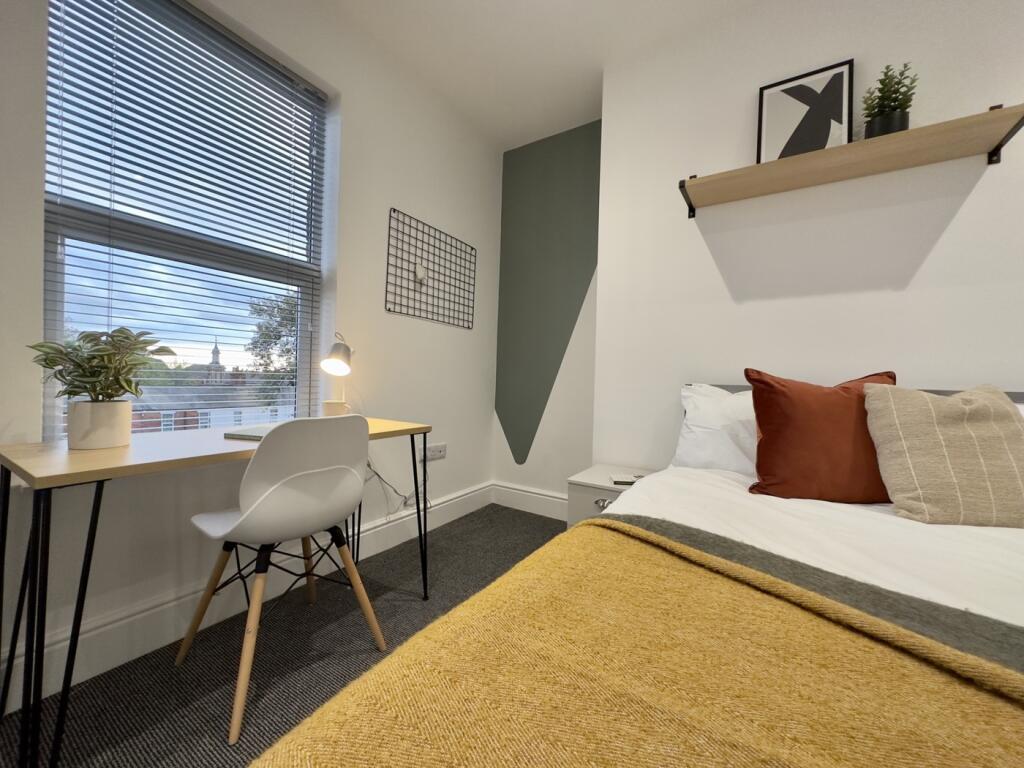 A stylish and inviting double bedroom featuring...