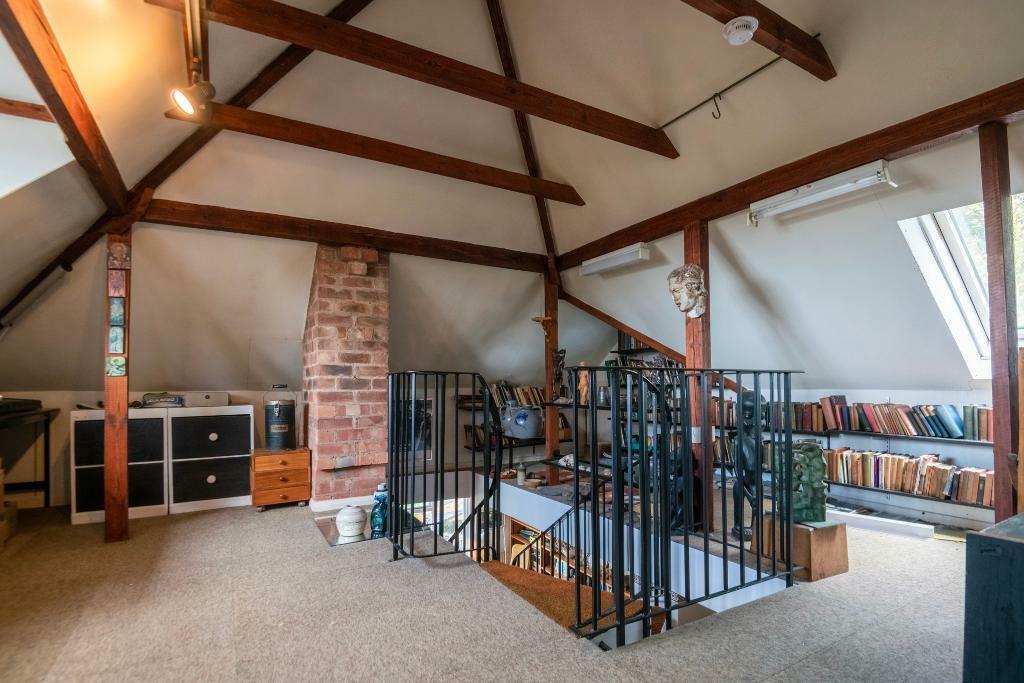 Studio with vaulted ceilings