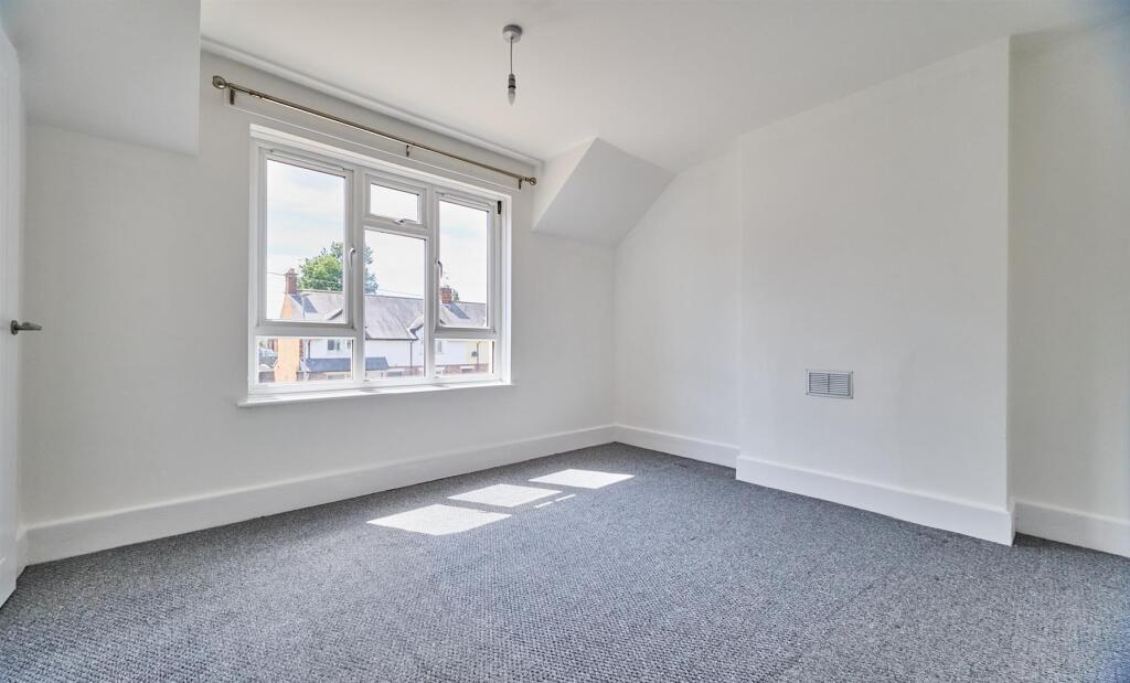 BEDROOM ONE TO FRONT