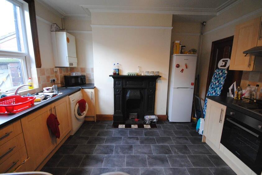 A well-maintained kitchen with ample counter sp...