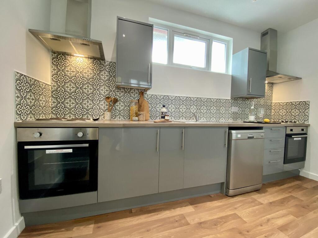 Modern and well-maintained kitchen with ample n...