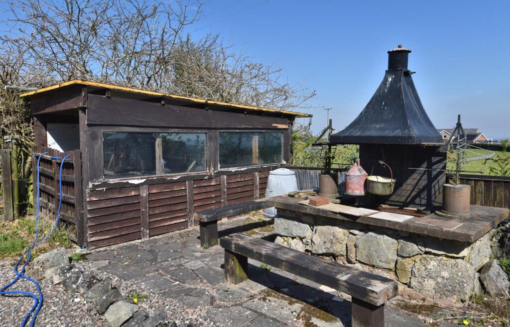SIDE PATIO WITH SHED AND BBQ