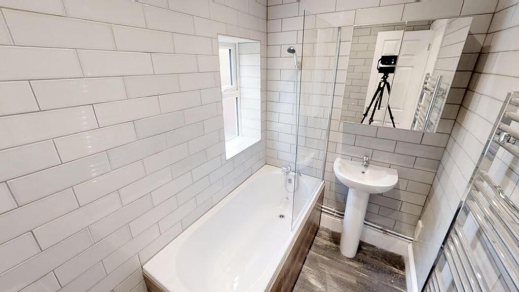 A beautifully designed bathroom featuring a mod...