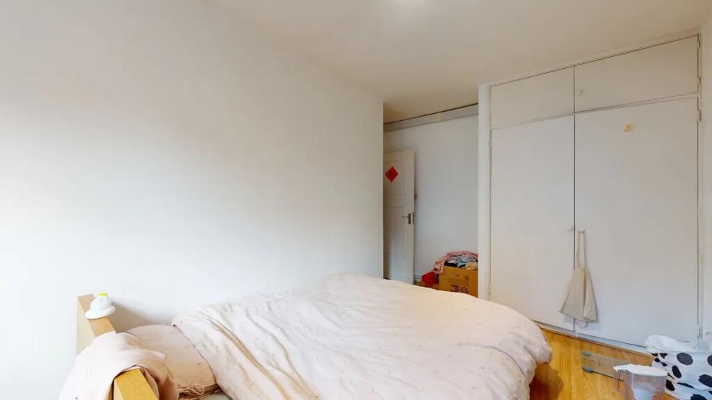 Bright and cozy double bedroom featuring clean ...