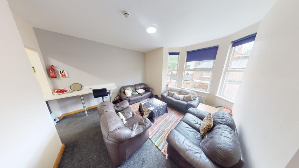 Bright and comfortable living room featuring la...