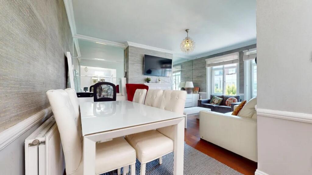 A stylish and bright living room featuring a co...