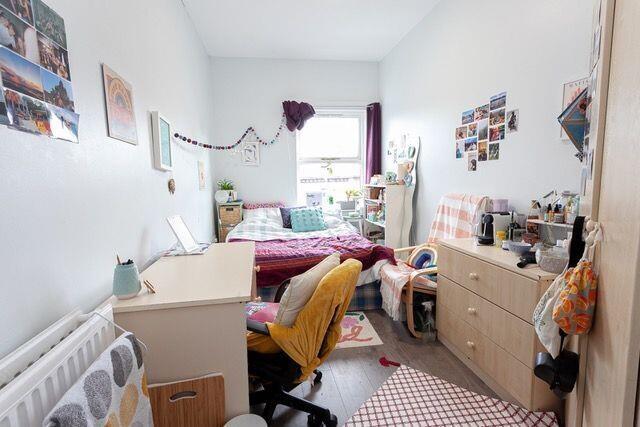 Cozy and personalized single bedroom featuring ...