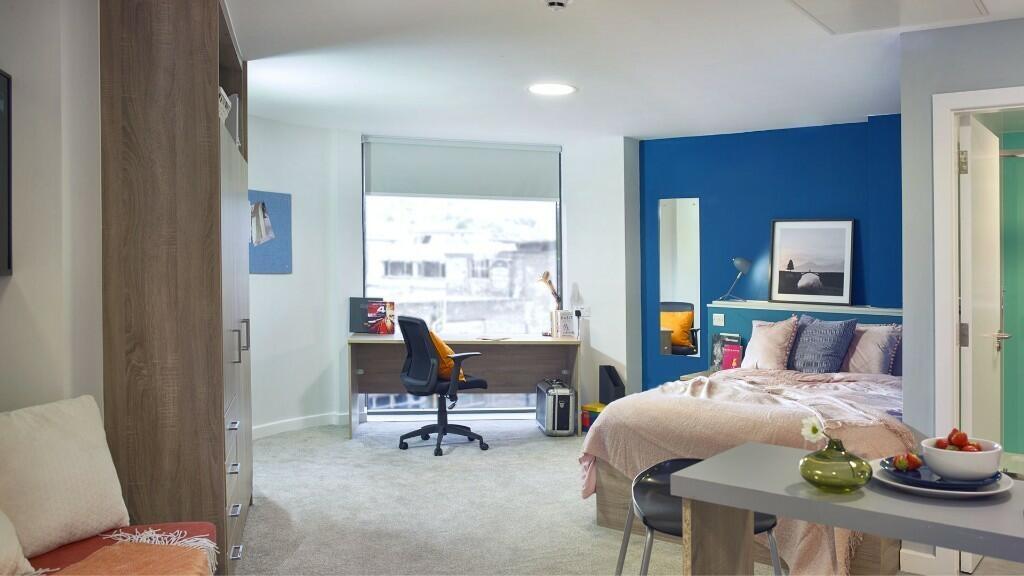 Bright and spacious master bedroom featuring a ...