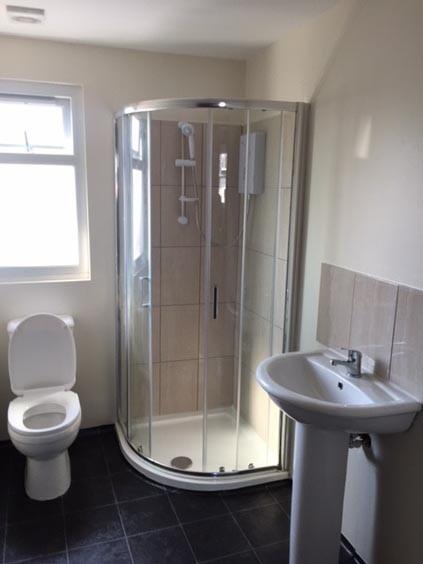 A clean and modern bathroom featuring a spaciou...