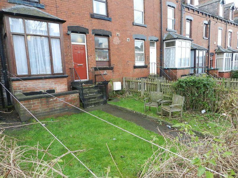 Front view of a traditional terraced house feat...
