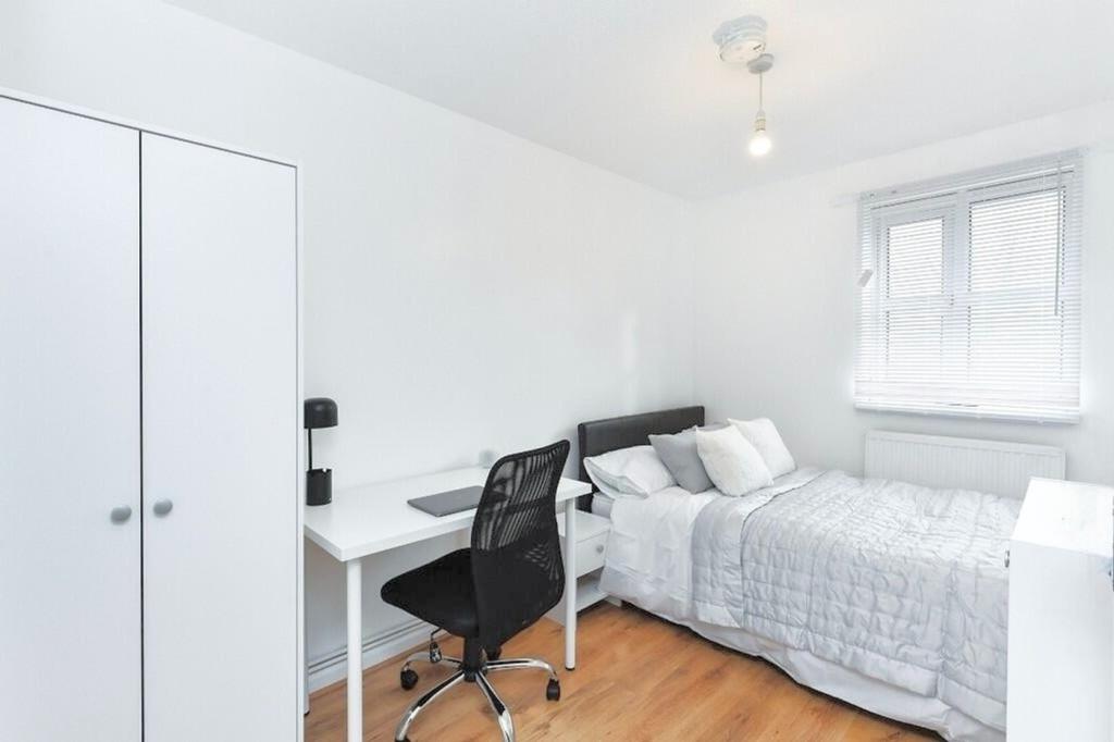 Bright and inviting double bedroom featuring a ...
