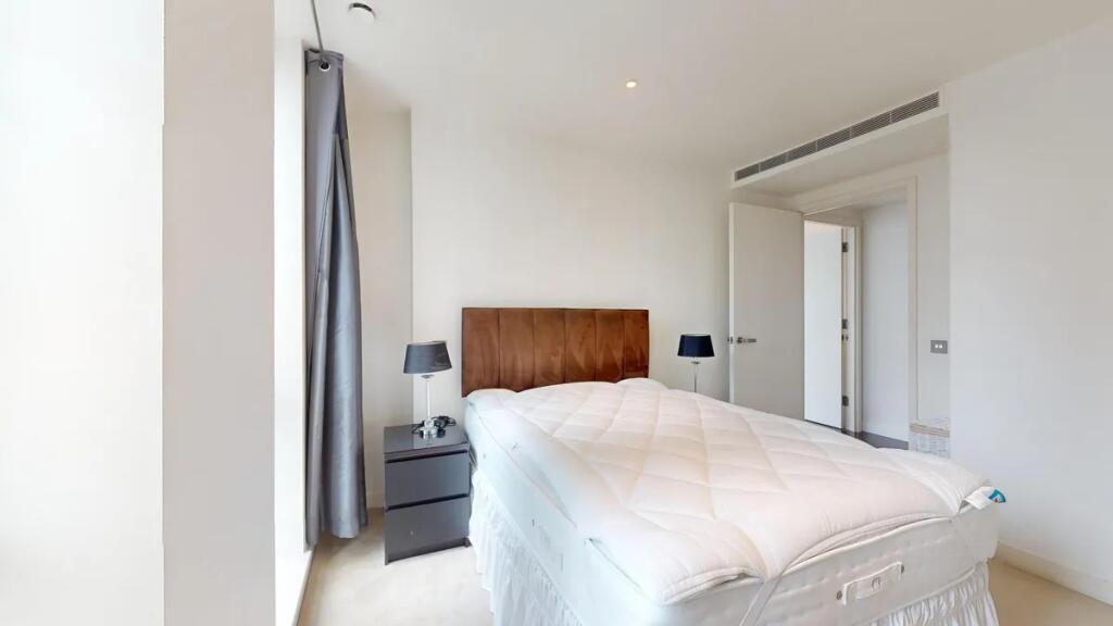 Bright and modern double bedroom featuring a co...