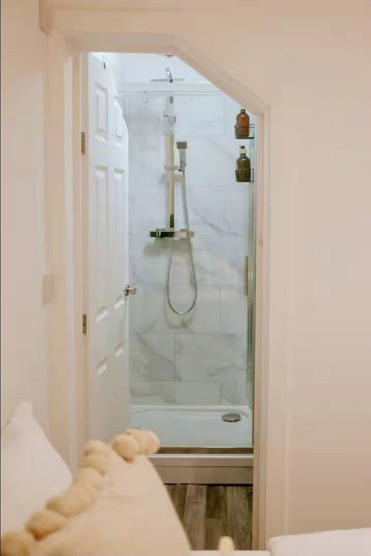 Bright and clean bathroom featuring a modern wa...