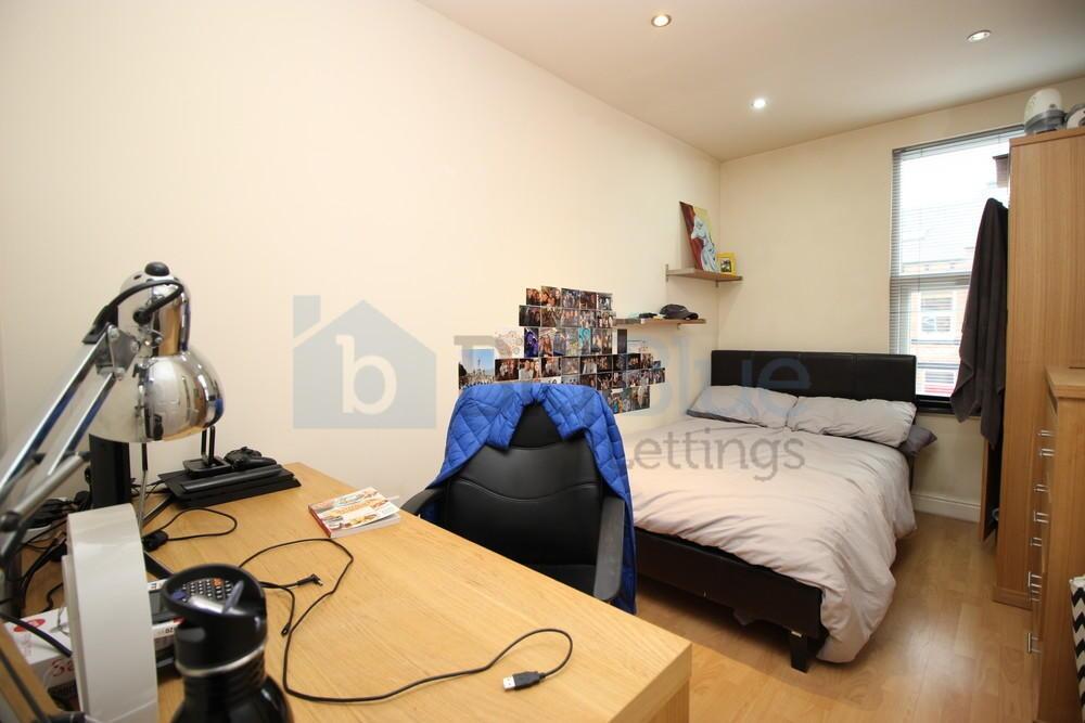 A cozy double bedroom featuring a comfortable d...