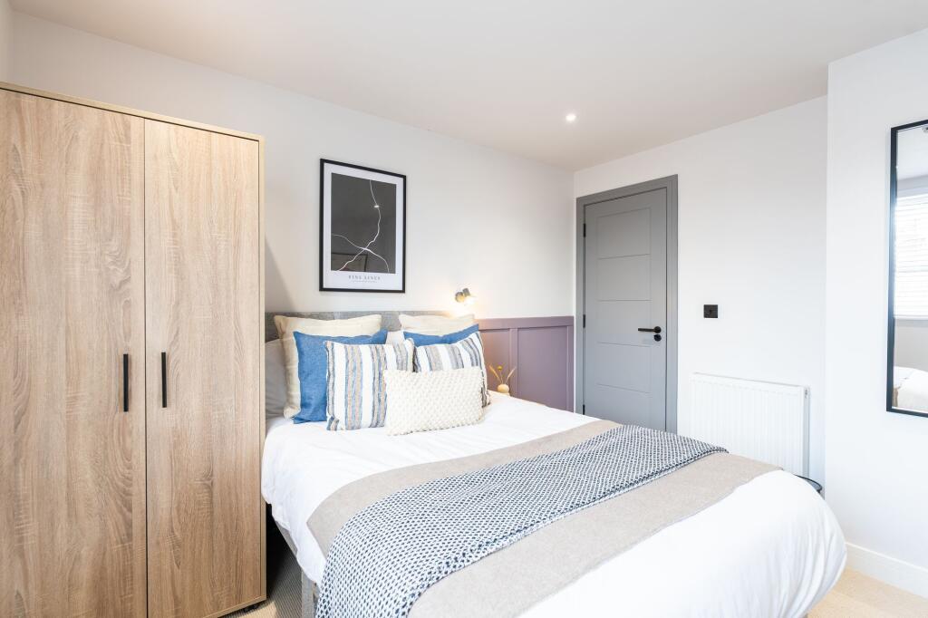 Bright and inviting double bedroom featuring a ...