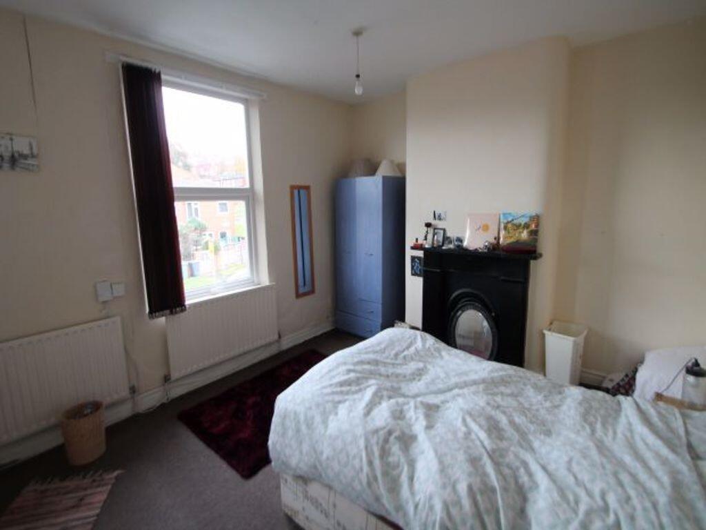A well-lit, clean double bedroom with a comfort...