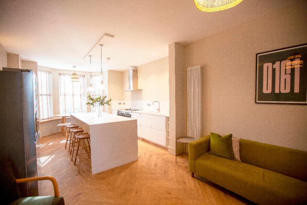 A modern and spacious kitchen with plenty of na...