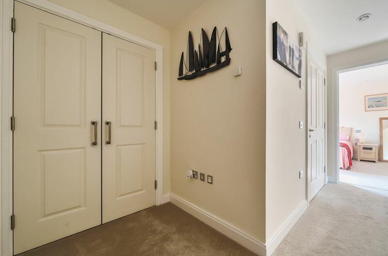 Hallway with storage cupboard