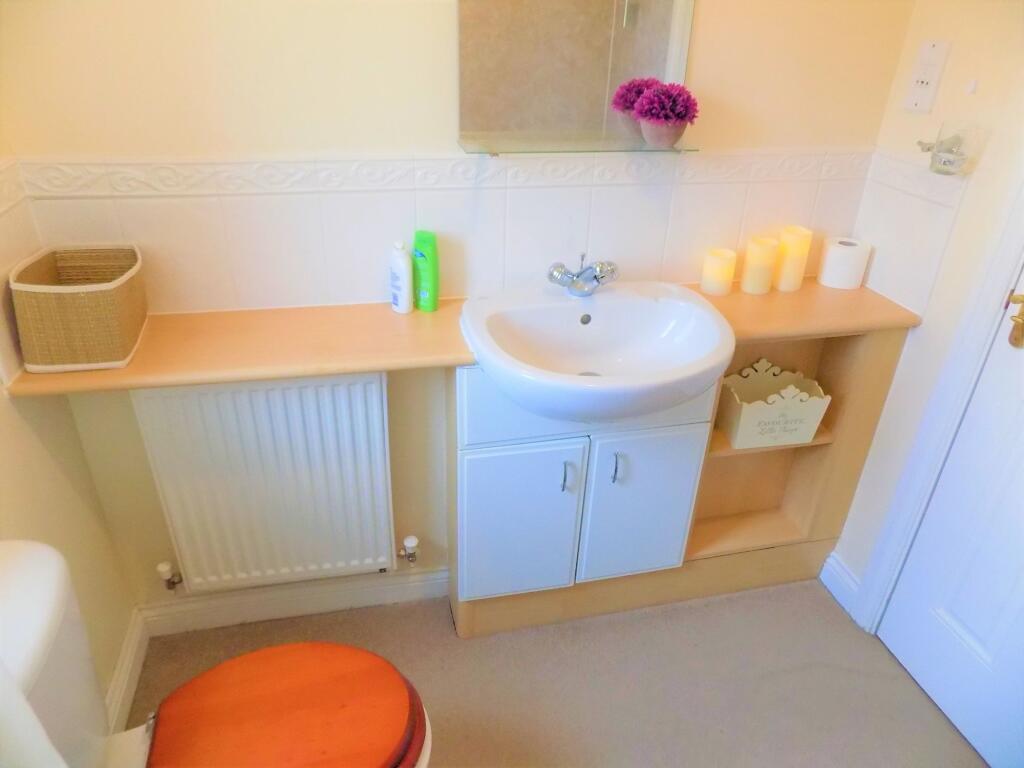 A neat and well-maintained bathroom featuring a...