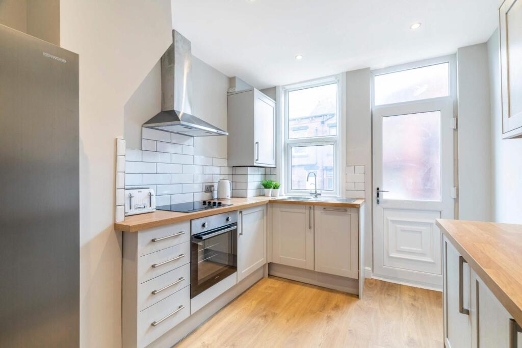 Bright and modern kitchen with ample natural li...