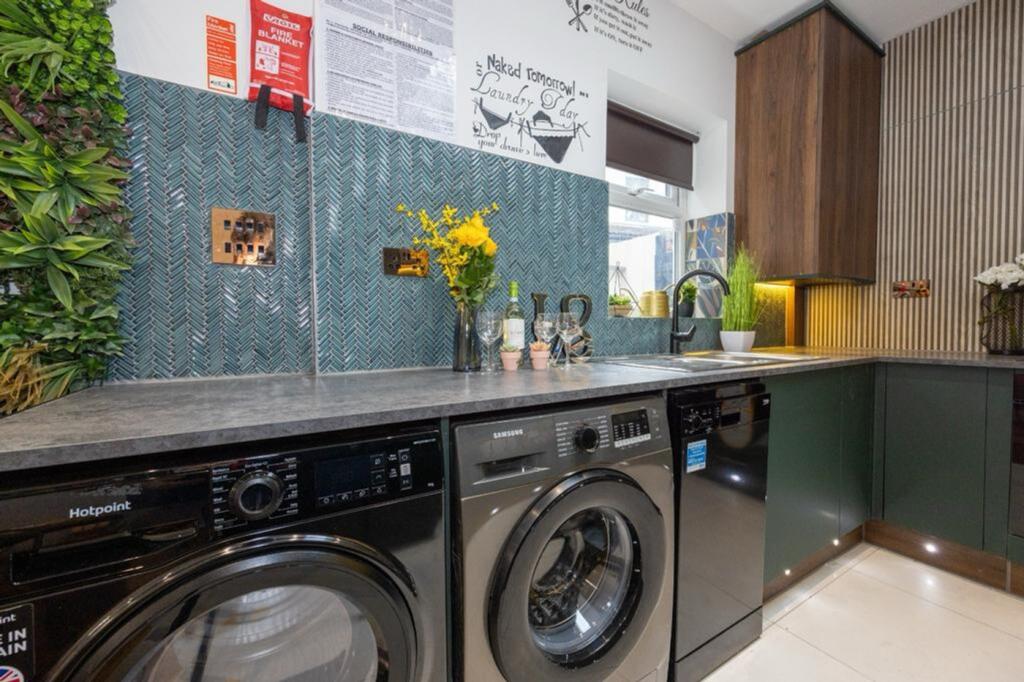 A modern and stylish kitchen featuring high-end...