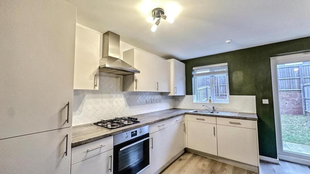 A modern and spacious kitchen with ample storag...