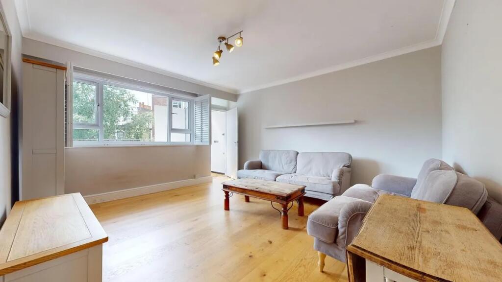 A bright and inviting living room featuring nat...