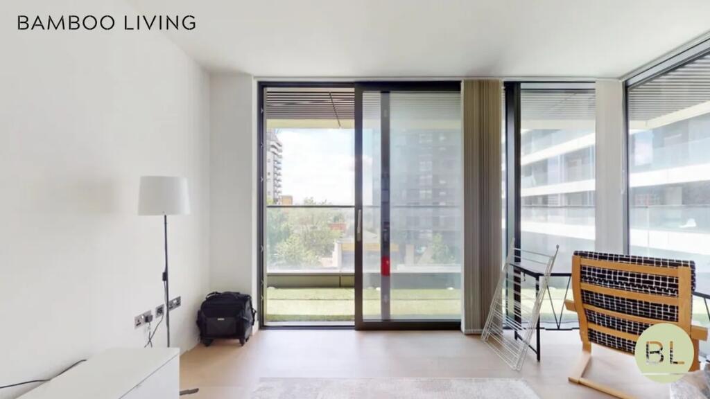 A bright and airy modern room with large floor-...
