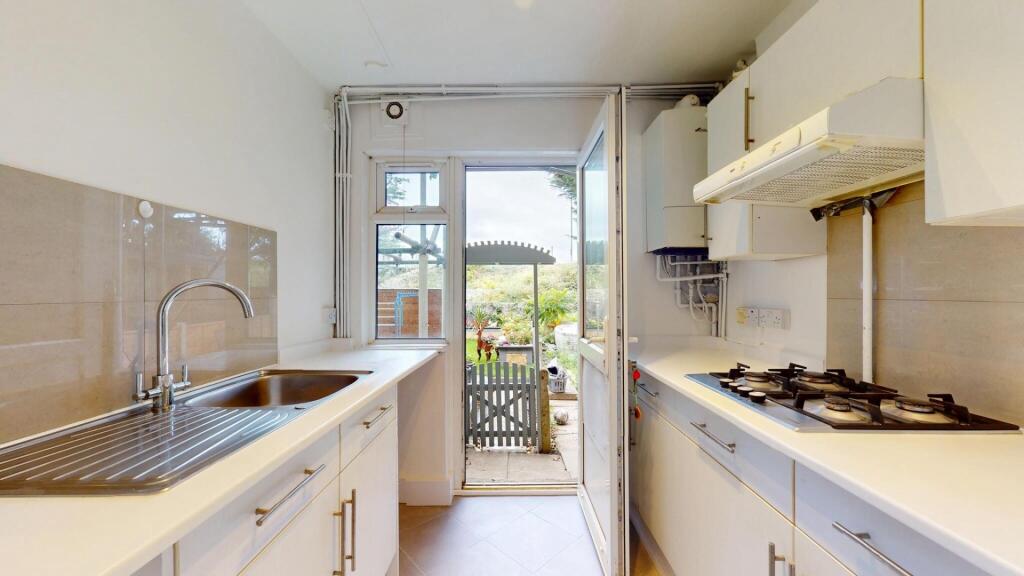 Bright and functional kitchen with ample counte...