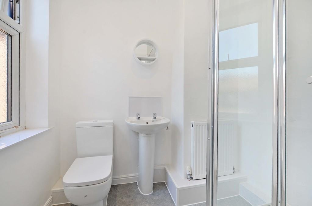 Bright and clean bathroom featuring a modern wh...