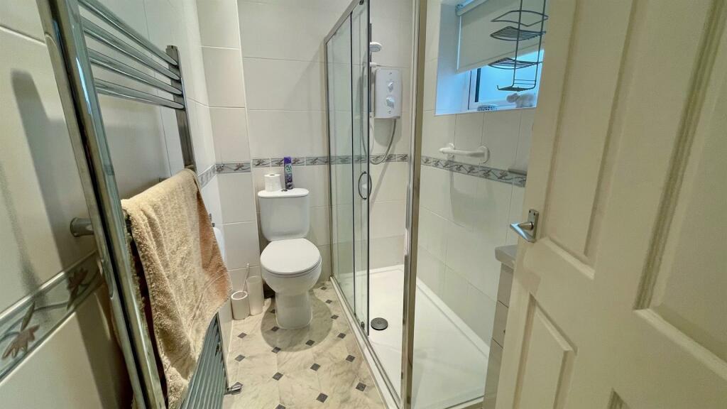 RE-FITTED TILED 3-PIECE SHOWER ROOM