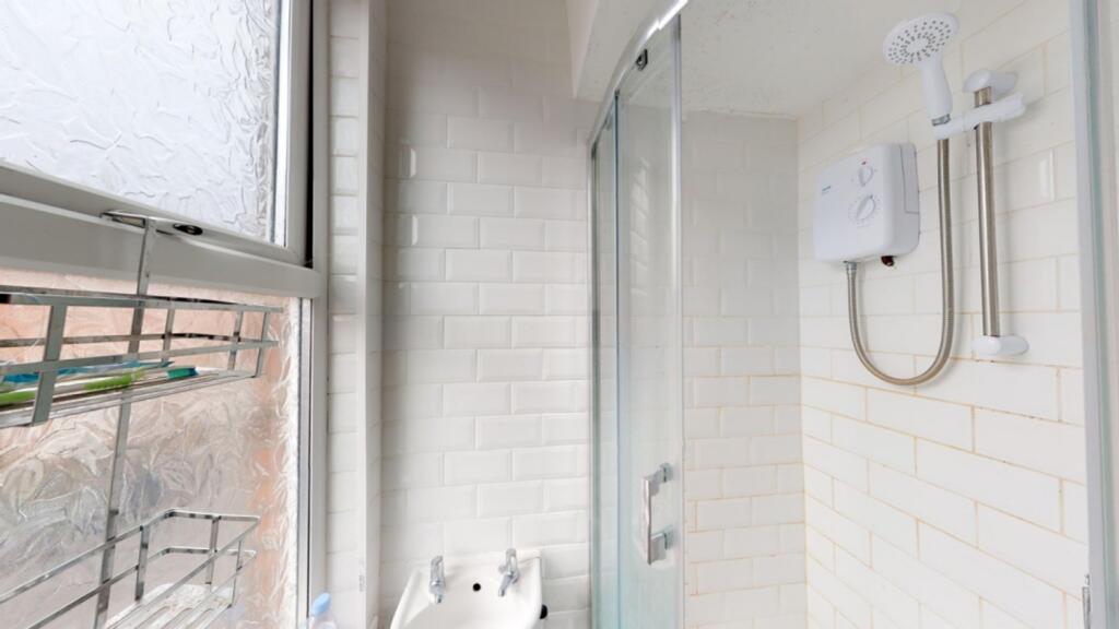 A bright and clean bathroom featuring a modern ...