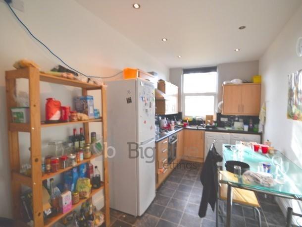 A bright and practical kitchen featuring ample ...