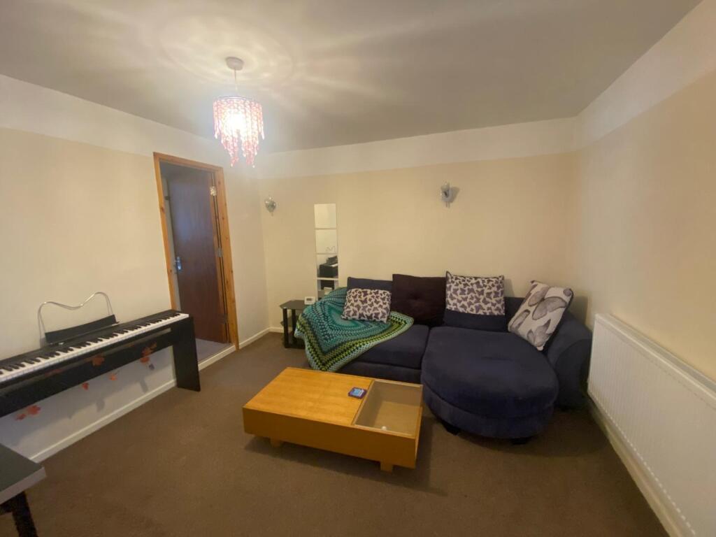 This inviting living room features a cozy seati...