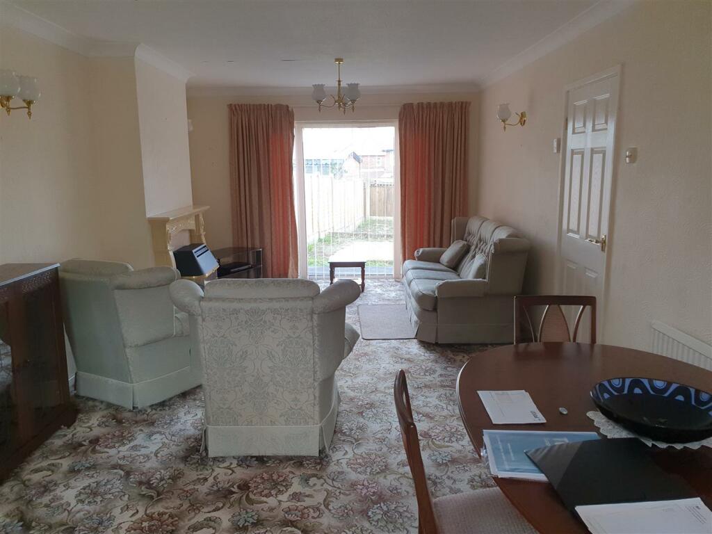 THROUGH LOUNGE/DINING ROOM