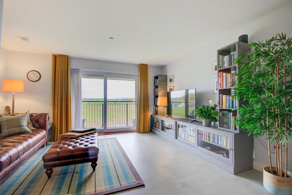 OPEN PLAN SITTING ROOM/KITCHEN