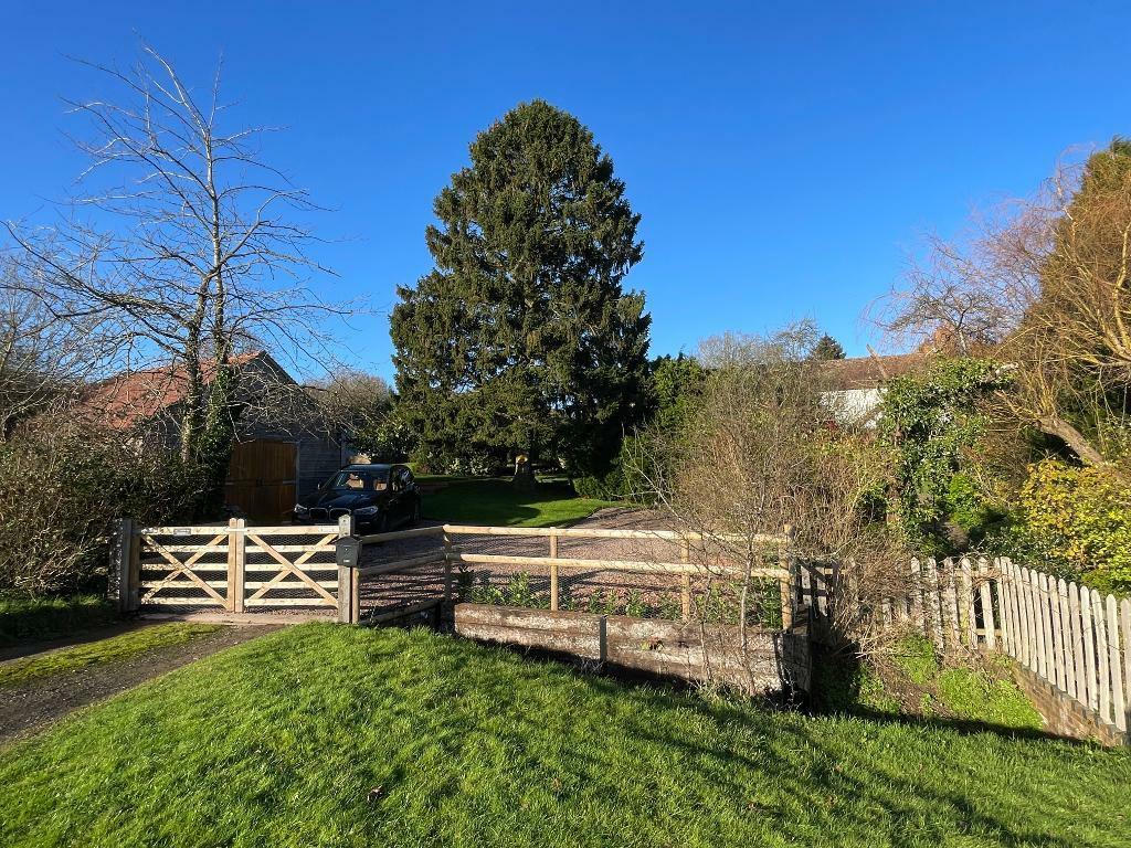 Gated entrance, driveway and garage