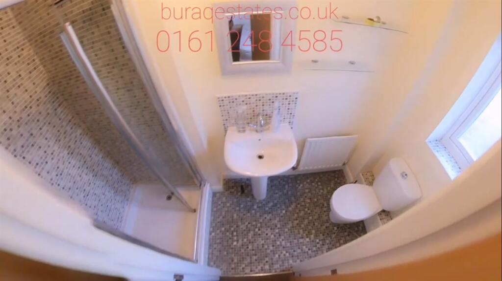 Bright, modern bathroom with a walk-in shower, ...