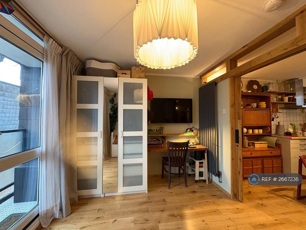 Living Room And Partial View Of The Kitchen 