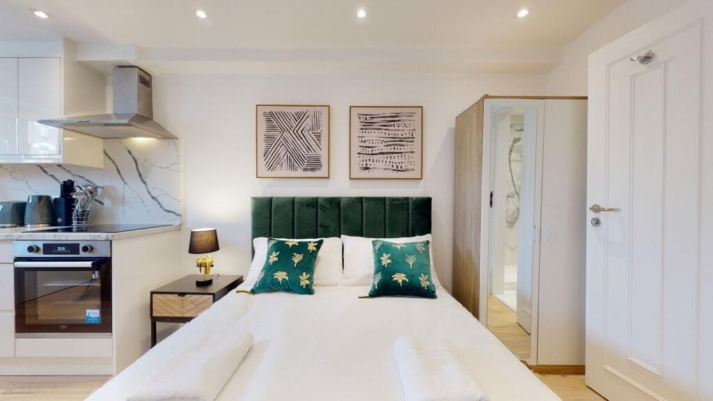 Bright and modern double bedroom featuring a co...