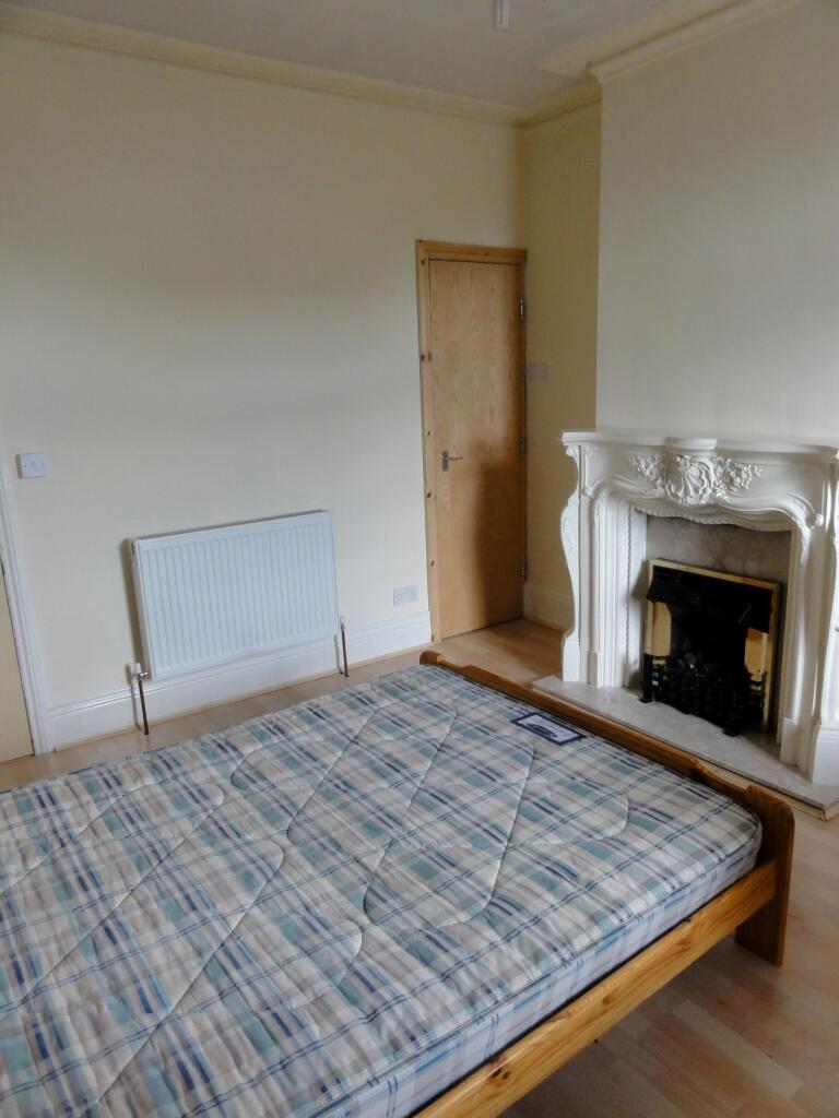 A bright and comfortable double bedroom featuri...