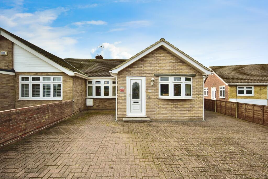 Outside View Of The Property With Driveway Parking
