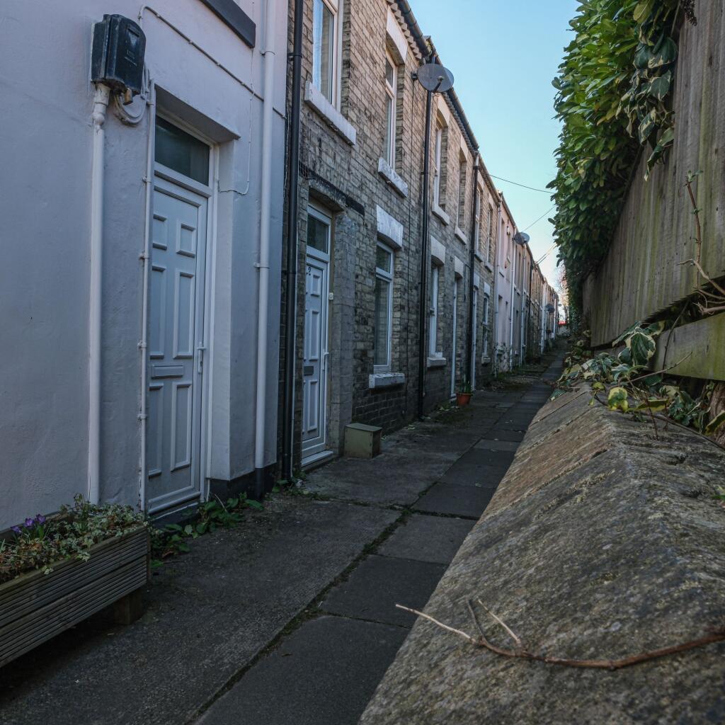 A row of traditional terraced houses with neat ...