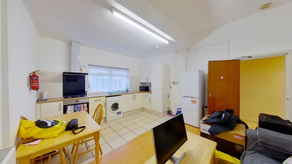 A spacious and bright kitchenette featuring mod...