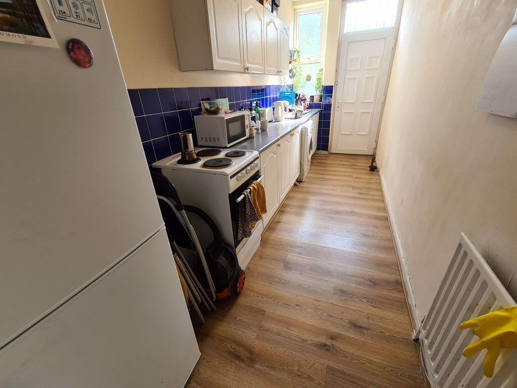 A bright and functional kitchen area with moder...