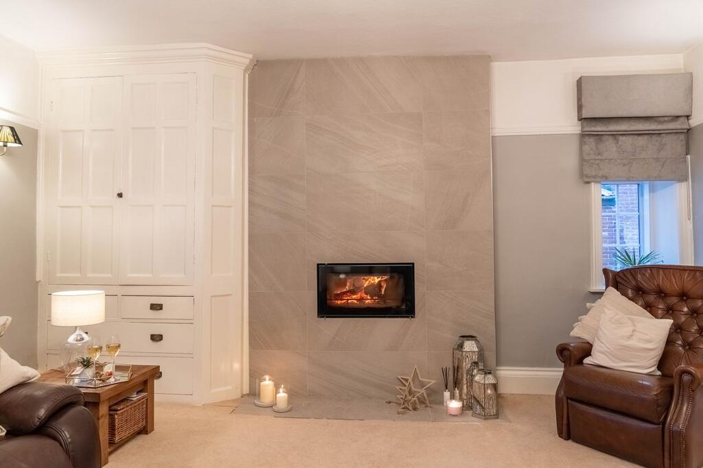 Tiled chimney breast and fitted storage