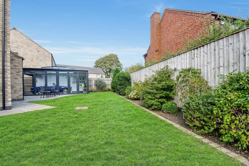 Side garden leading to addition garden room/worksh