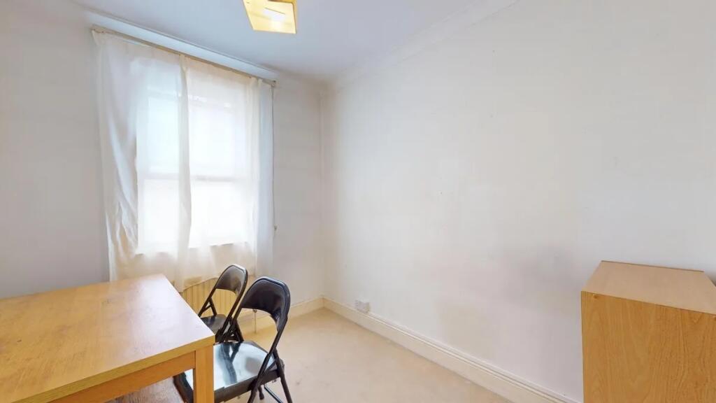 Bright and simple communal workspace featuring ...