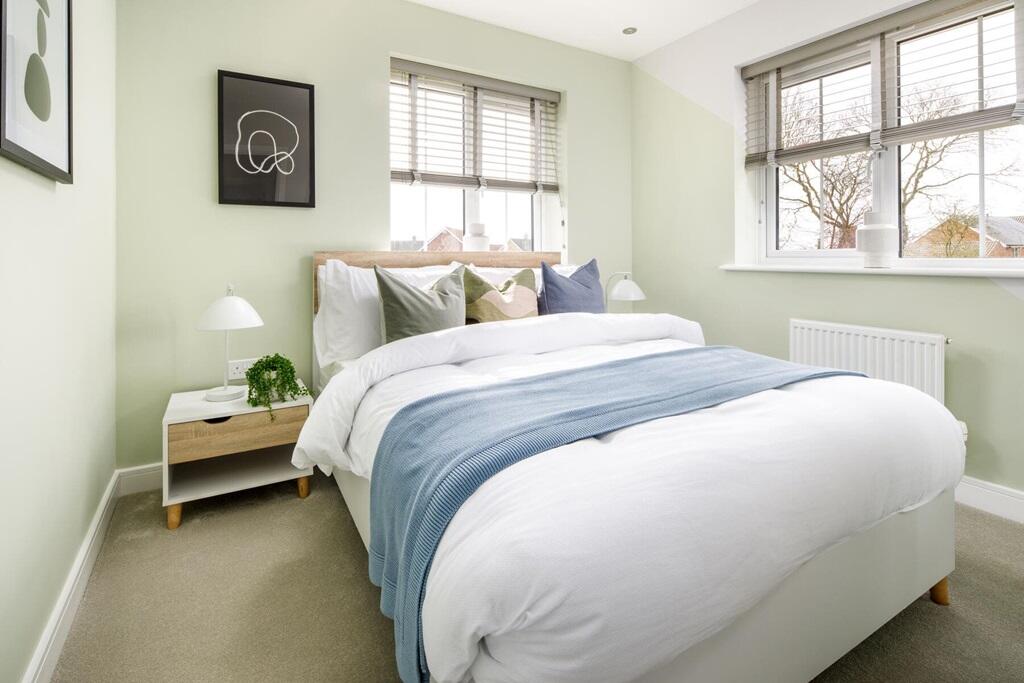 Bedroom 2 is an ideal guest bedroom, with space for a double bed